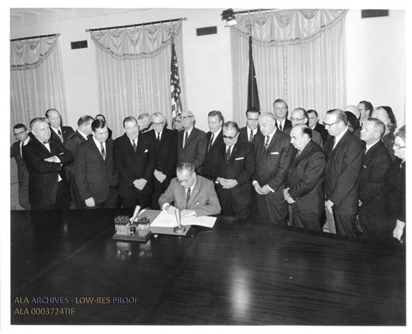 President Lyndon Johnson signing the Library Services Act